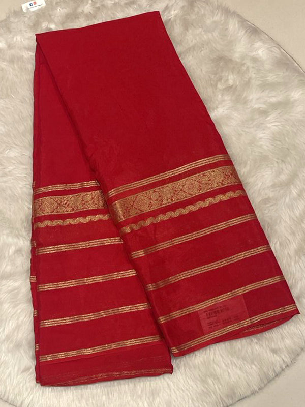 Bright red solid Banarasi crepe saree featuring zari stripes border for weddings