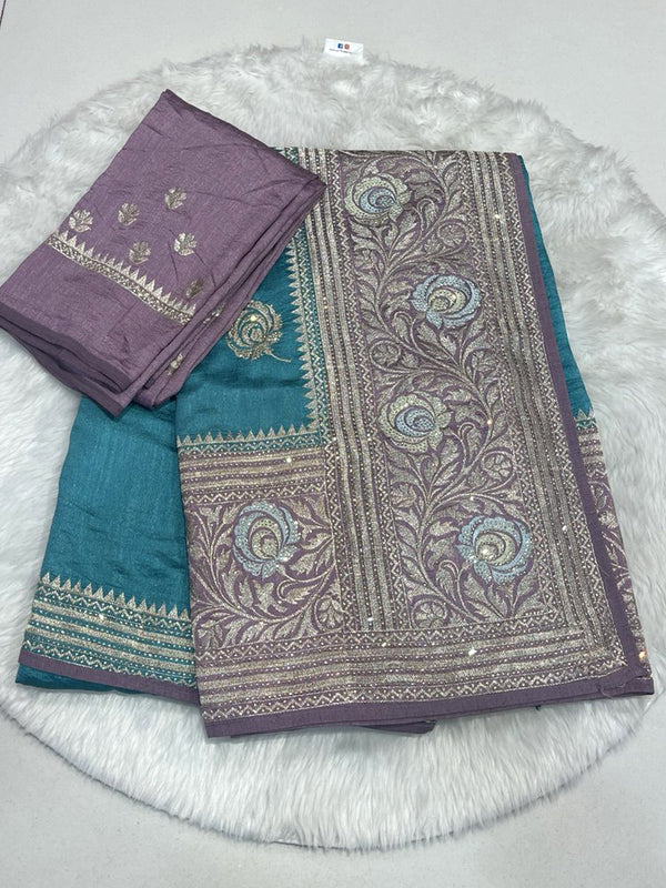 Teal Saree with Heavy Contrast Mauve Pallu featuring Dense Silver Zari Embroidery and Shimmering Stone Work.