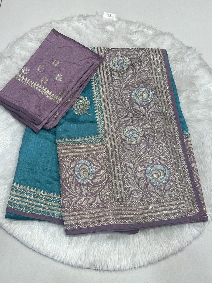 Teal Saree with Heavy Contrast Mauve Pallu featuring Dense Silver Zari Embroidery and Shimmering Stone Work.