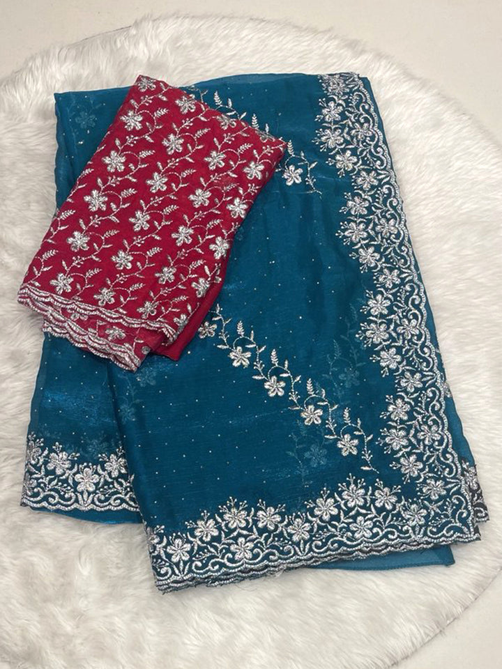 Teal Blue Chiffon Saree with Heavy Silver Zari Floral Cutwork Border and Vibrant Contrast Designer Blouse.