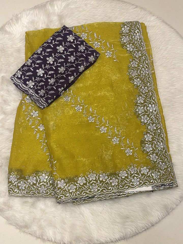 Lime Green Chiffon Saree with Heavy Silver Zari Floral Cutwork Border and Vibrant Contrast Designer Blouse.