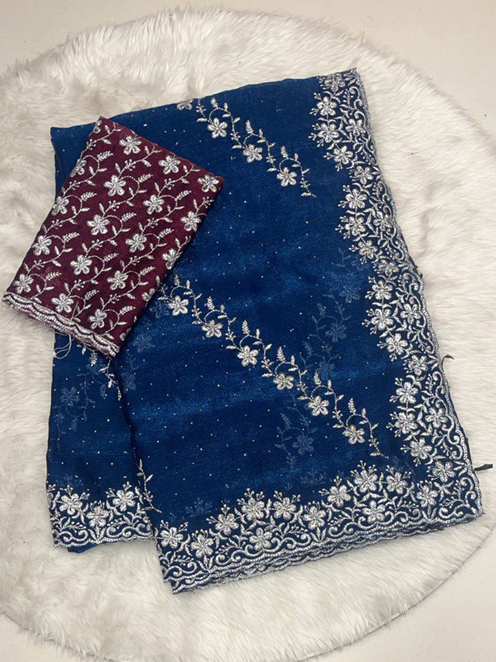 Navy Chiffon Saree with Heavy Silver Zari Floral Cutwork Border and Vibrant Contrast Designer Blouse.