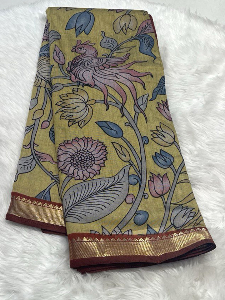 Mustard Yellow Maheshwari saree with artistic pen kalamkari bird design and zari border.