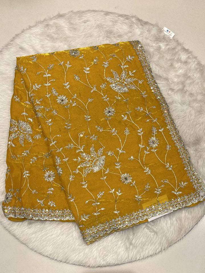 Mustard Yellow Space Silk Saree with silver antique zari work and scalloped edges for weddings